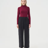 Wide black pants for women with elastic waistband. DV Bourgogne log sleeve turtleneck top for women.