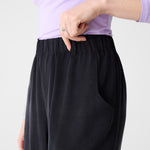 Wide black pants with elastic waistband for women.